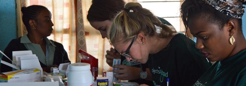 Volunteers prepare medicines on an outreach project in Tanzania On an outreach project in Tanzania volunteers help with medicine dispensing