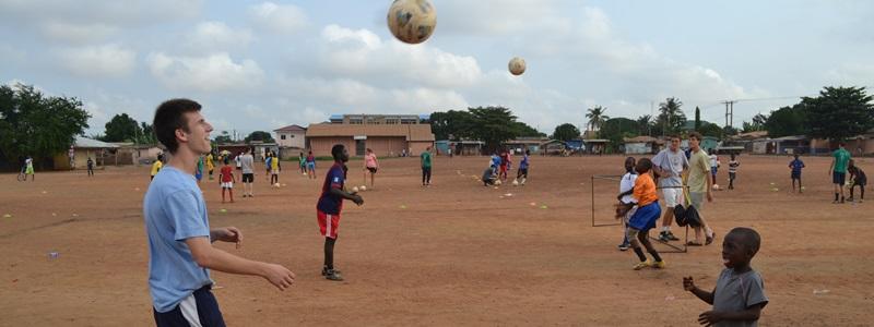 Volunteers Coach a Football Team Overseas with Projects Abroad Volunteers coach football at a school abroad on the Sports project